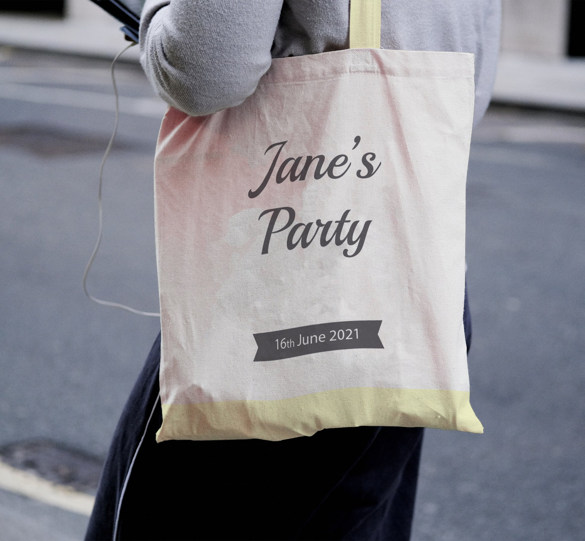 person wearing personalised tote bag with text and date