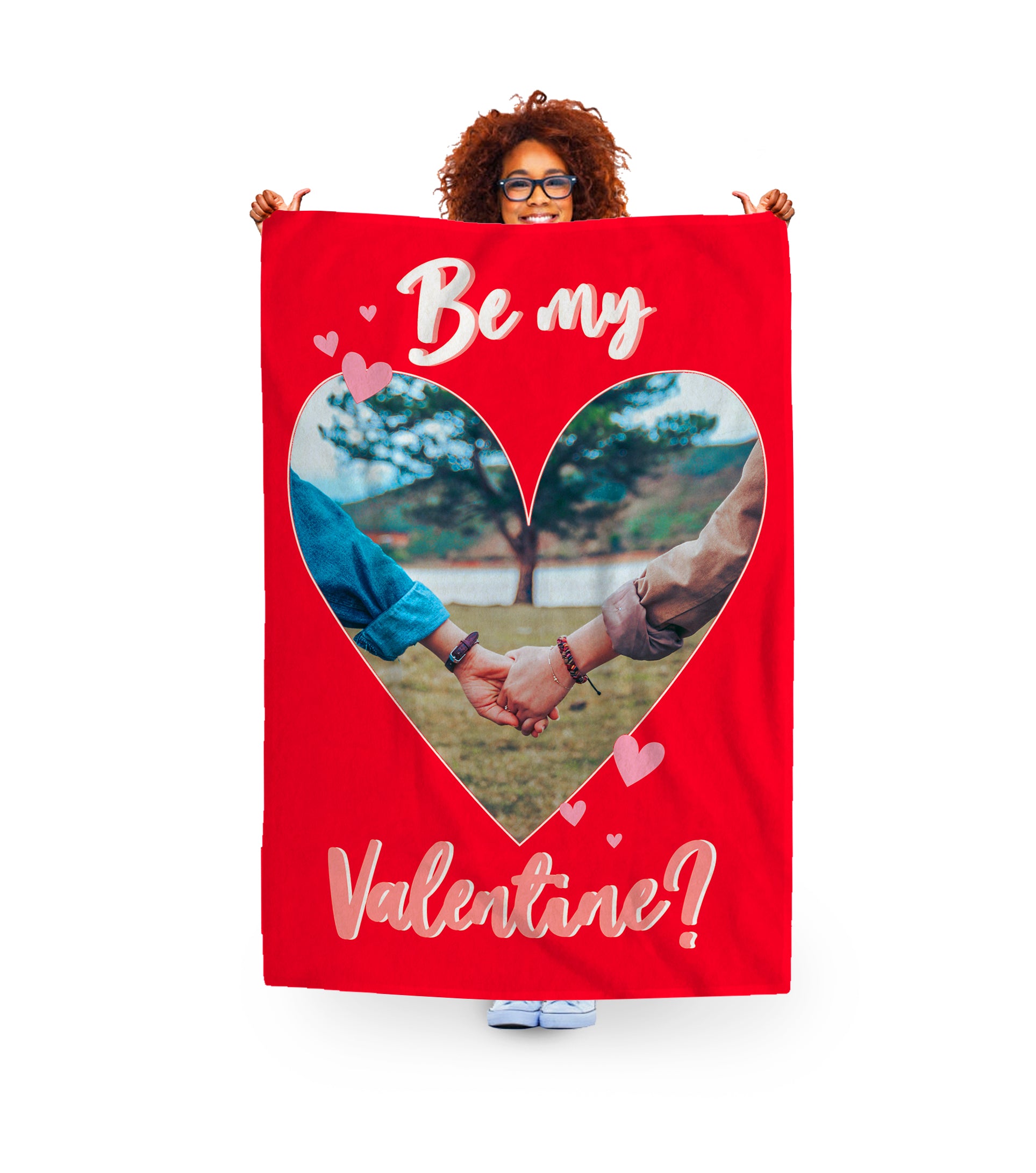 woman holding valentines photo blanket. couple photo and text. heart shaped images.