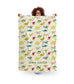 woman holding a personalised dino fleece blanket for kids with name