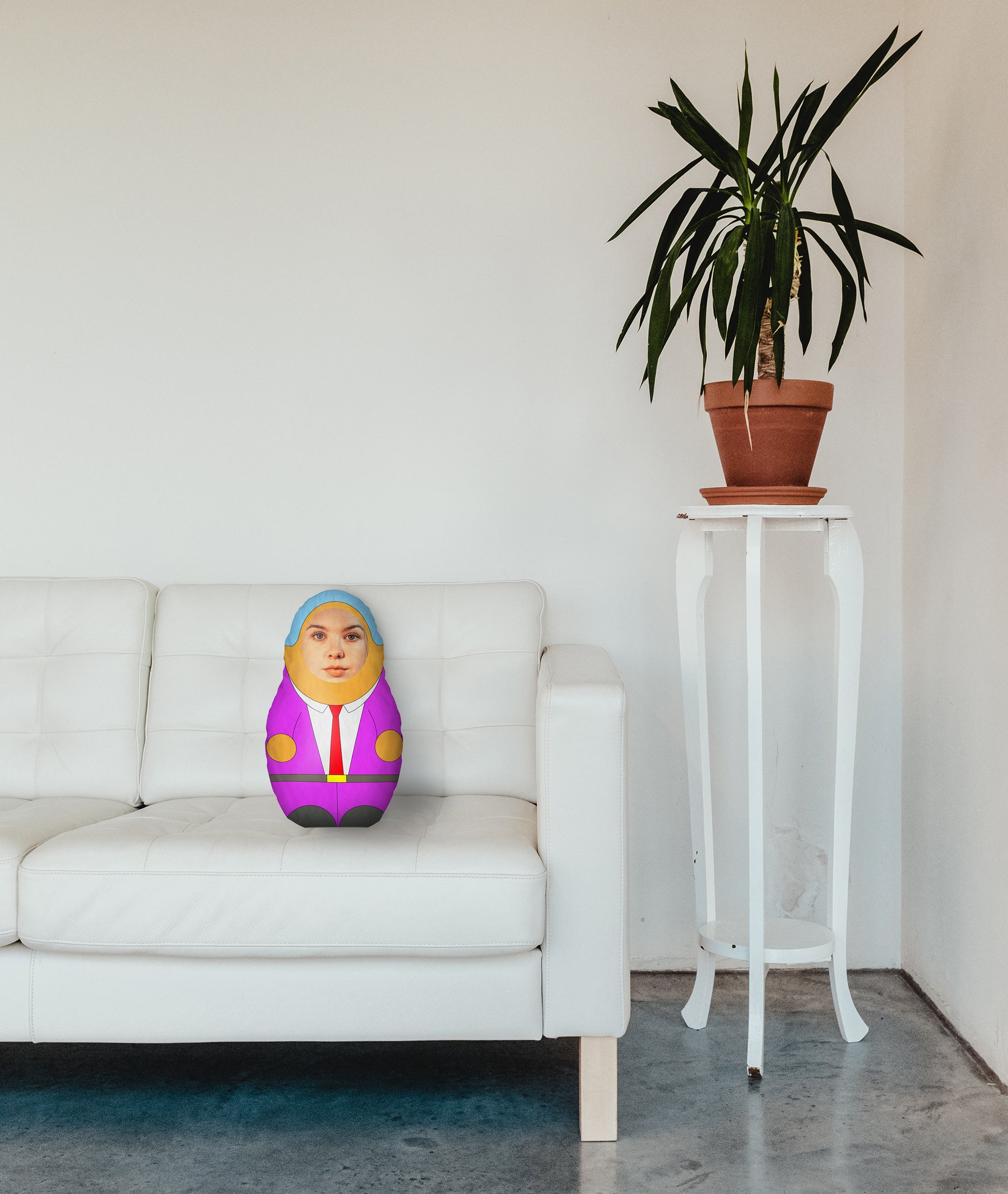mini me doll with women face on sofa
