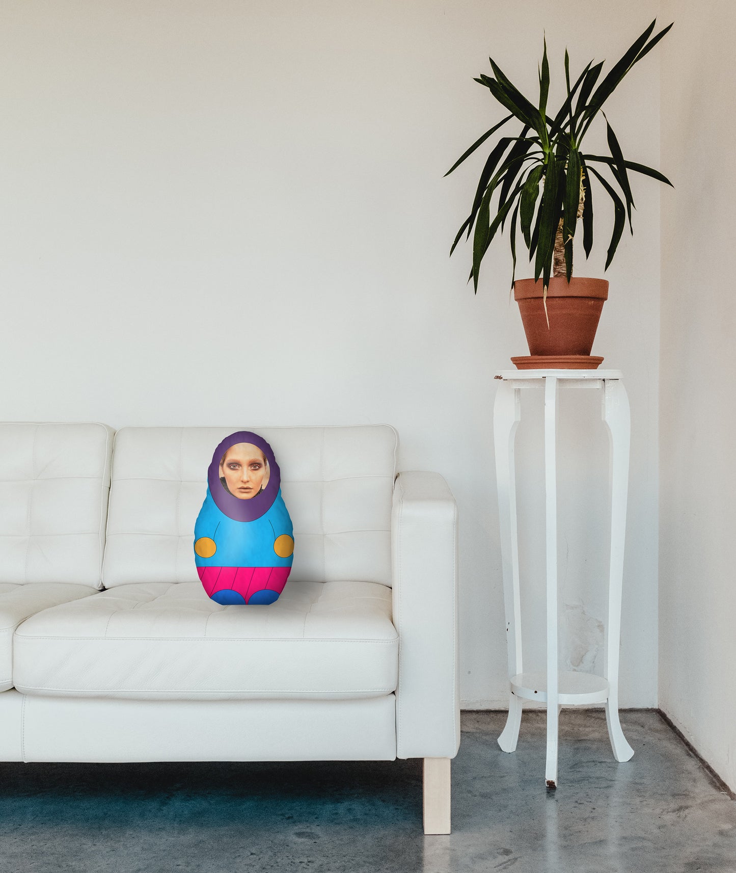 Blue and pink mini me doll on sofa