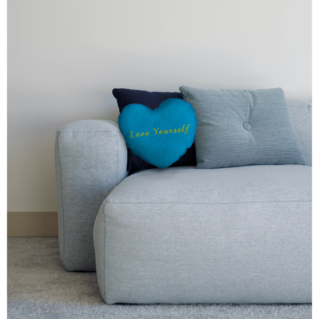 blue heart cushion on sofa with cushions