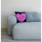 pinkl heart cushion on sofa with cushions