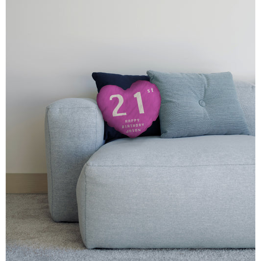 Pink heart cushion on sofa with cushions